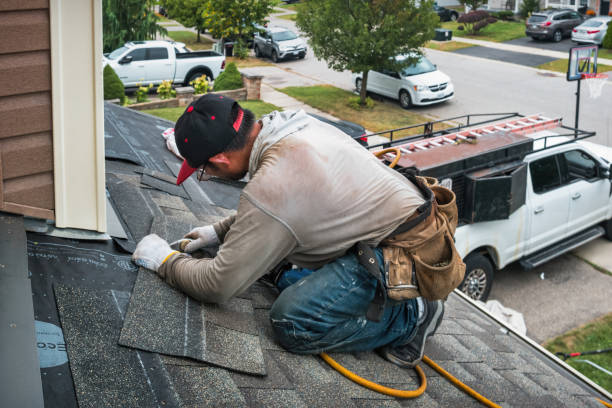Professional Roofing technician working in New England, ND